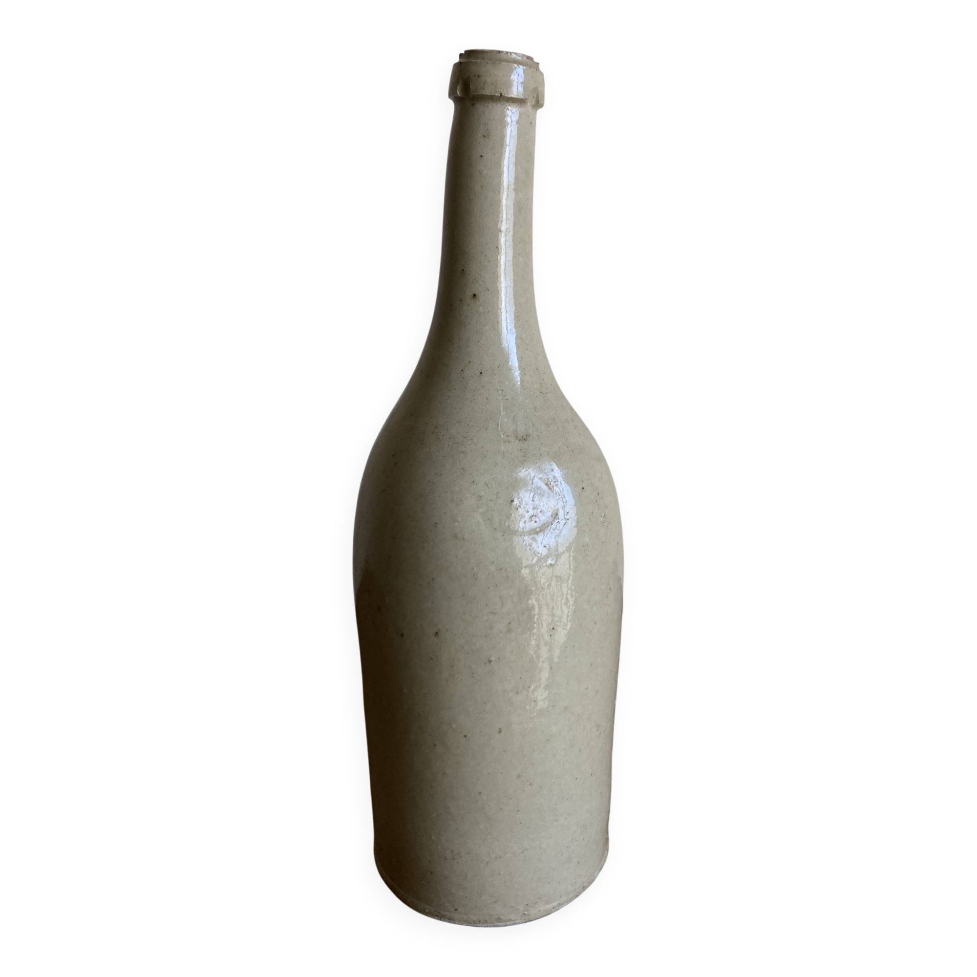 Stoneware bottle tilted at an angle, early 20th century