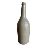 Stoneware bottle tilted at an angle, early 20th century