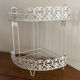 Corner shelf in openwork metal