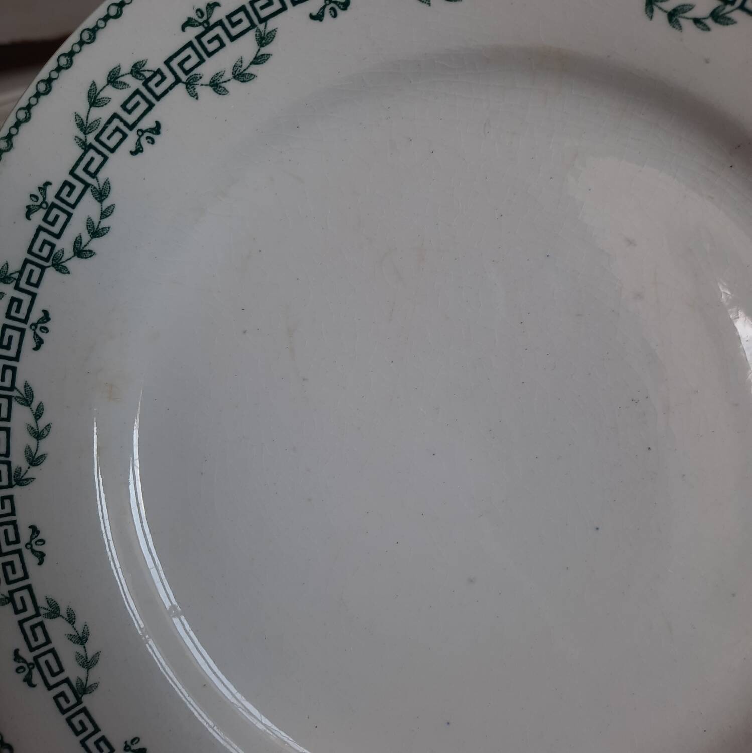 Old mismatched iron earthenware dessert plates accompanied by a dish