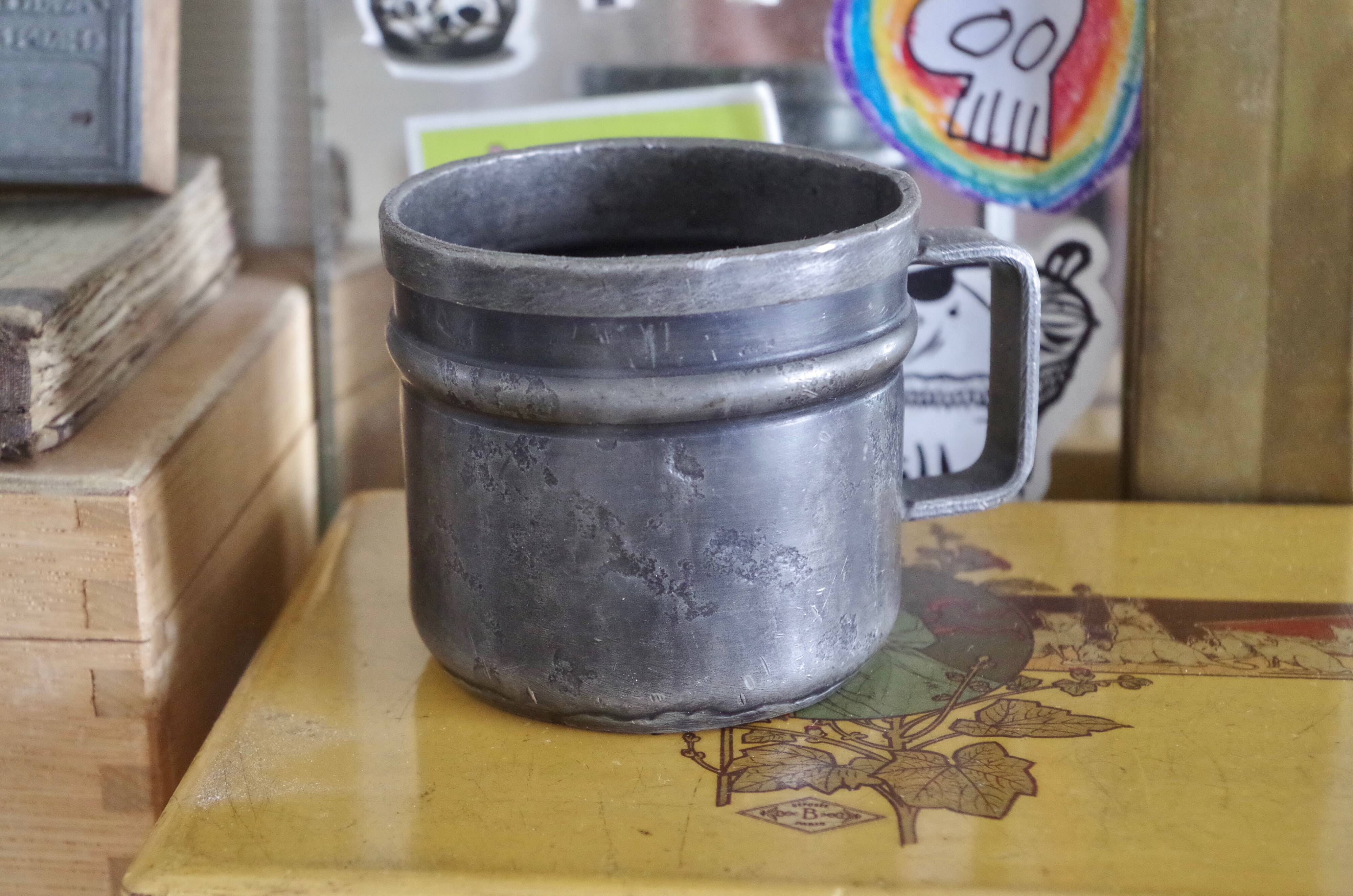 Old tin cup
