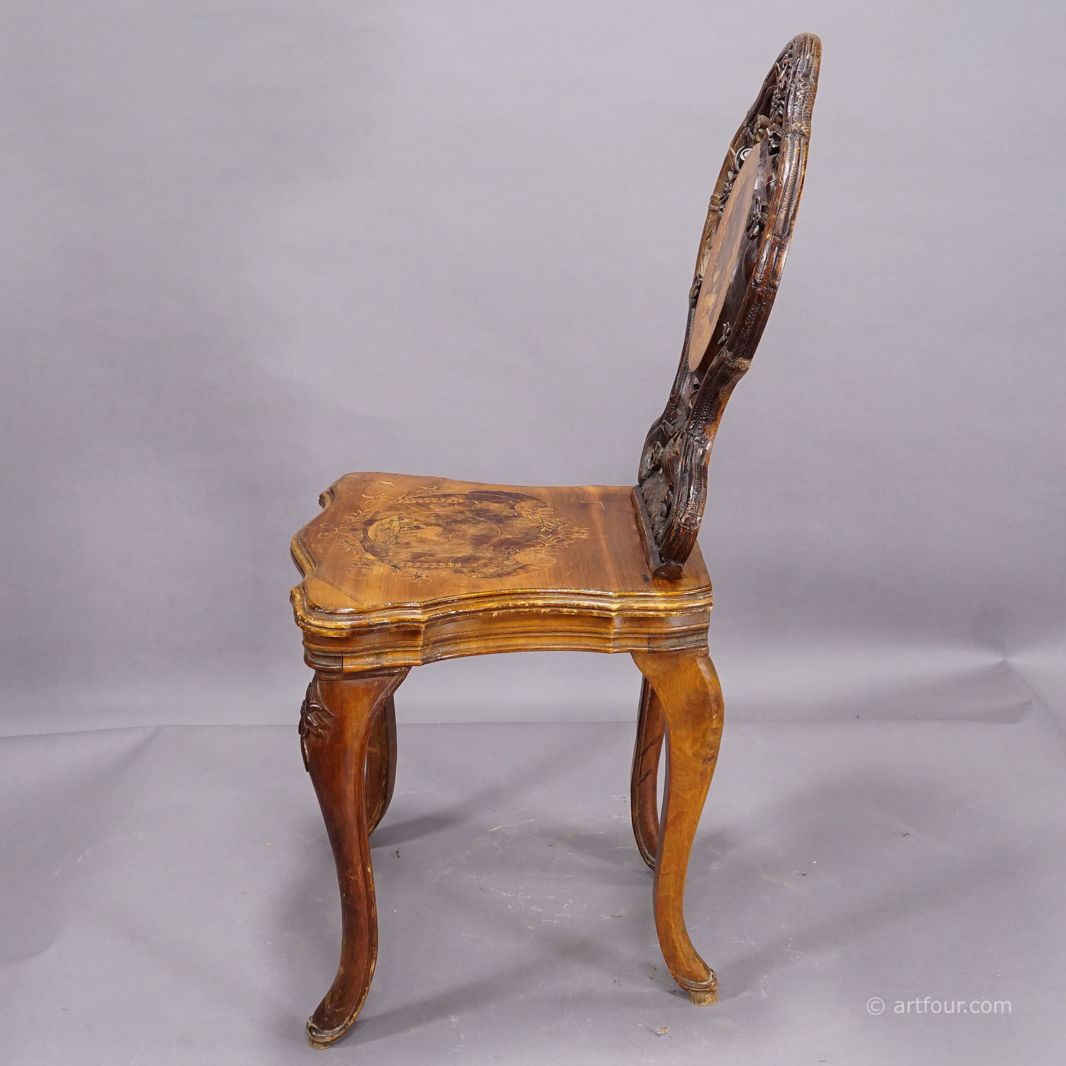 Pair of walnut chairs with Edelweiss marquetry, Brienz Switzerland 1900