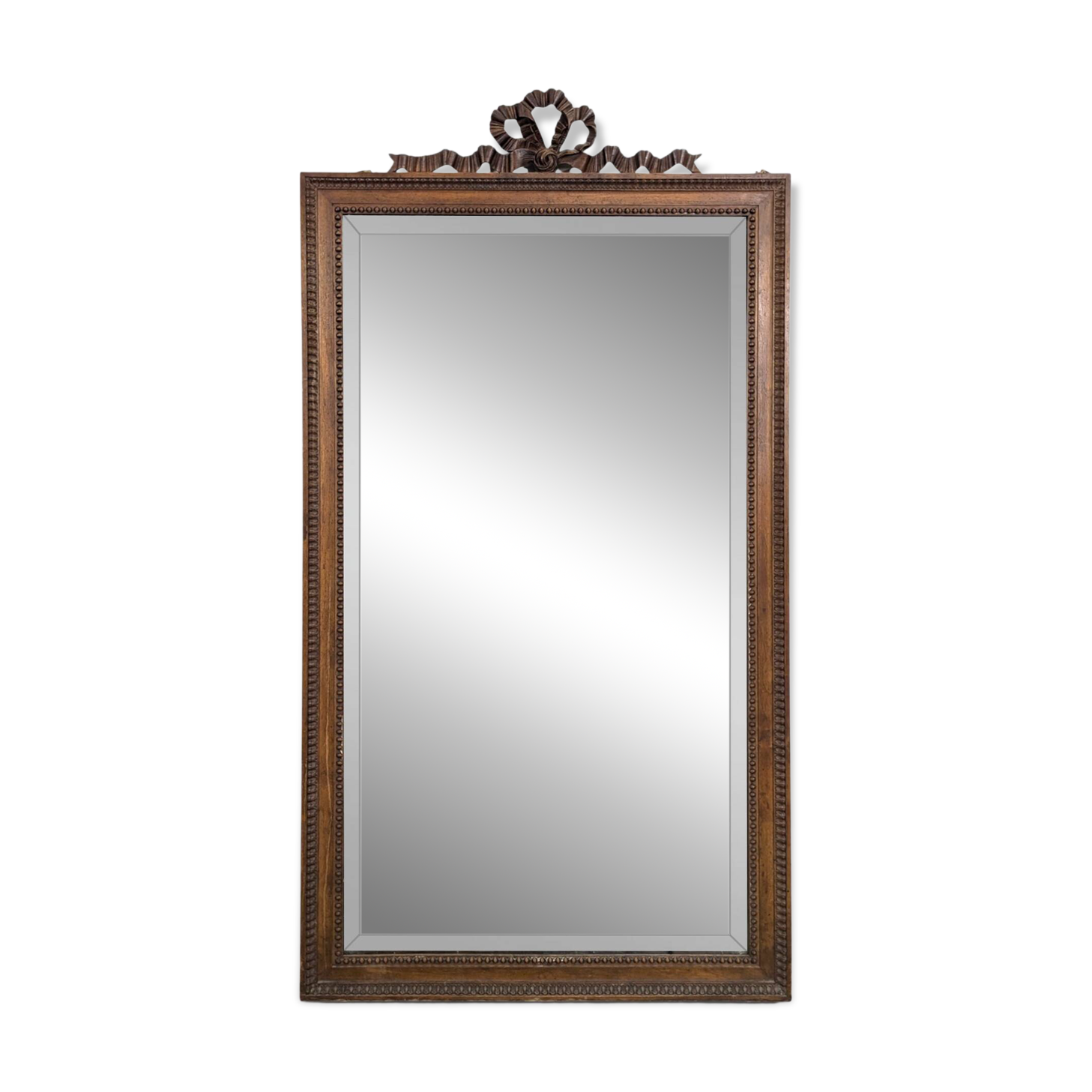 Louis XVI style mirror in carved walnut.