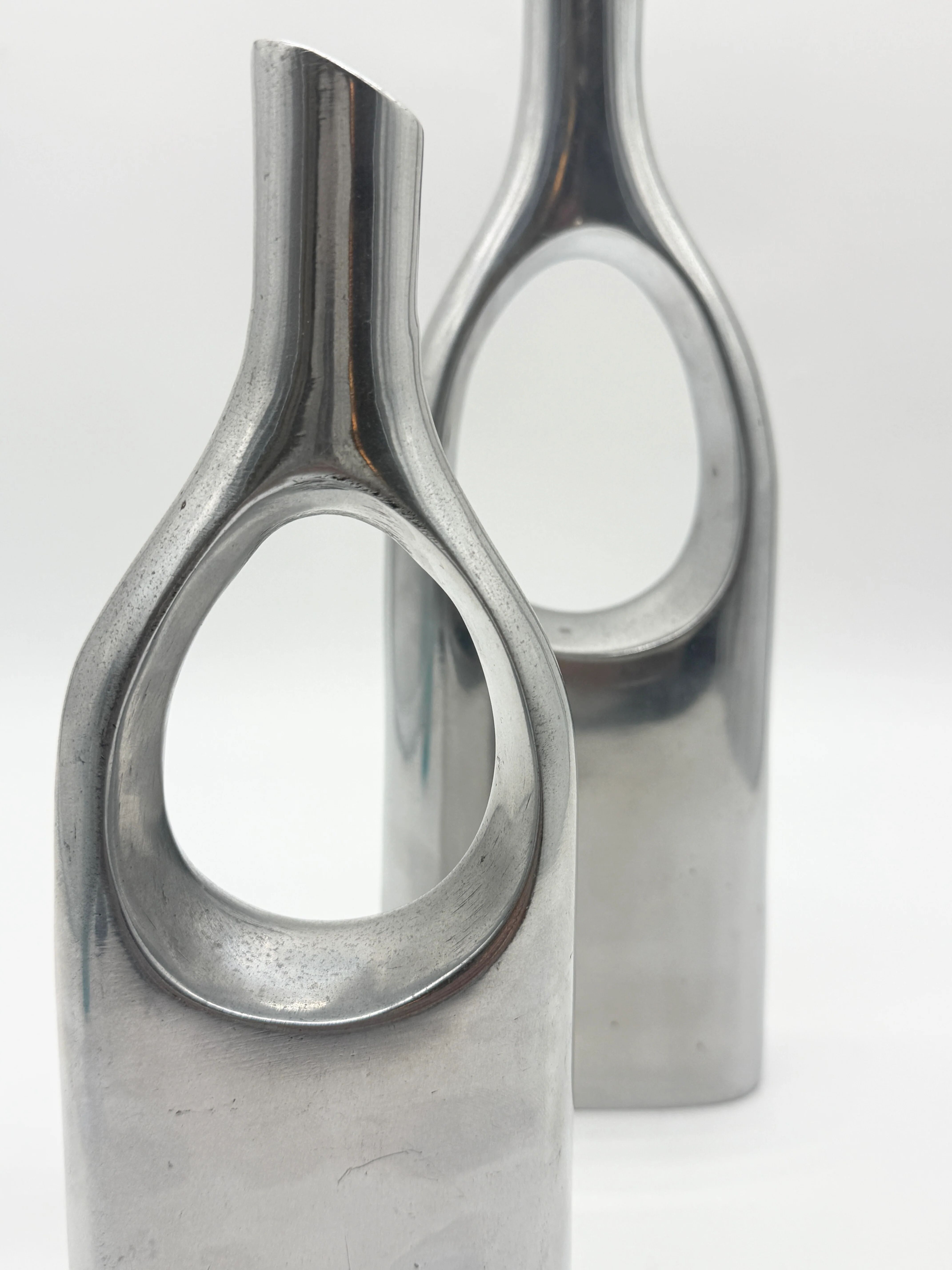 Pair of "drop" vases in aluminium cast, Italy, 1970s