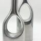 Pair of "drop" vases in aluminium cast, Italy, 1970s