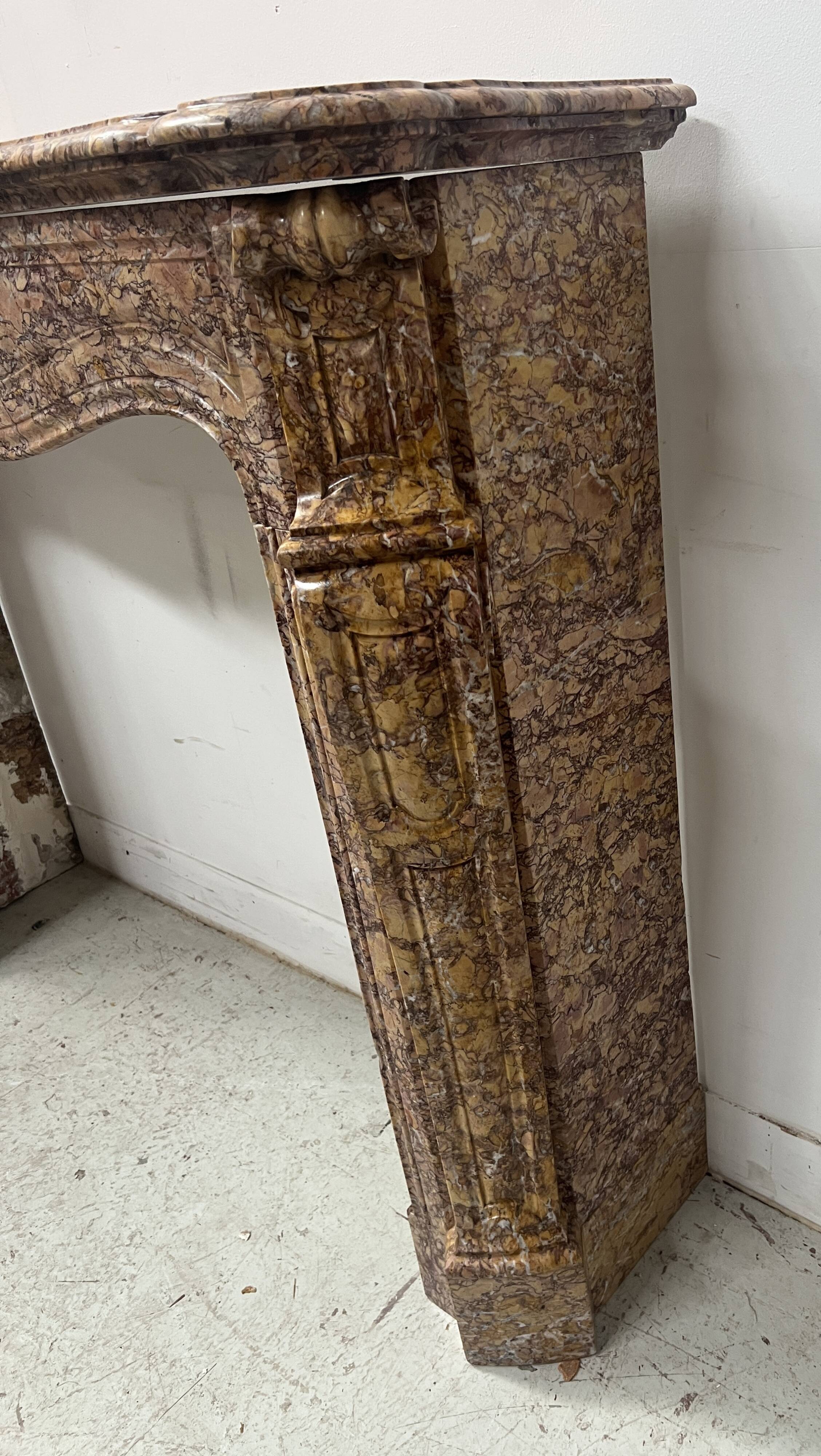 Louis XV style fireplace, Pompadour model, speckled breccia marble, 19th century