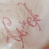 Handmade red lettered pillowcase.