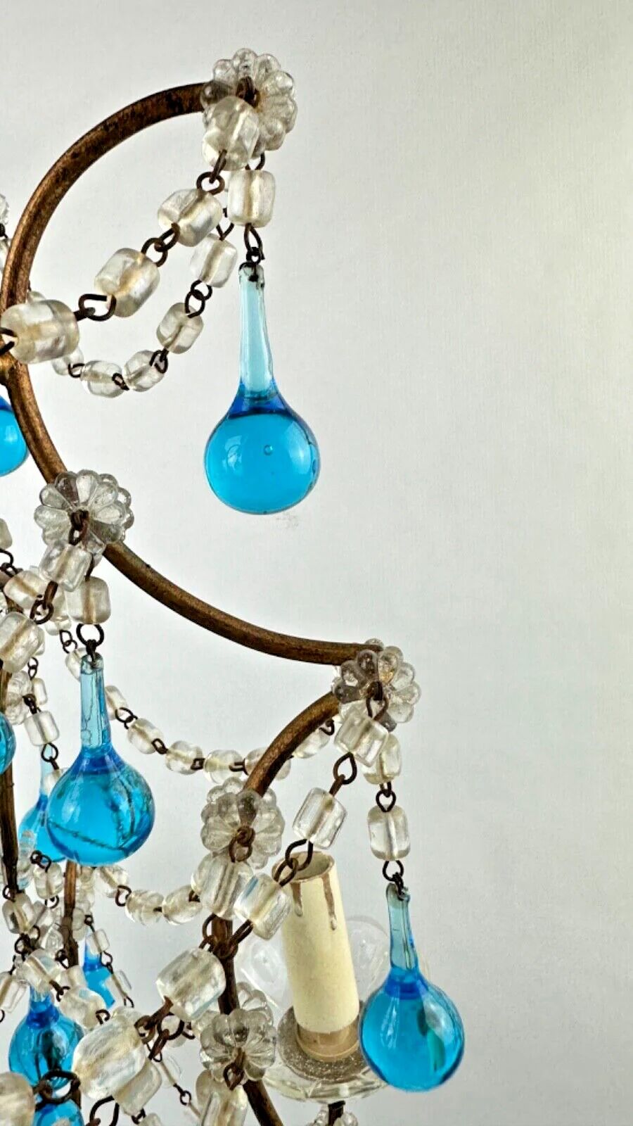 Italian chandelier with blue beads and gilded wood.