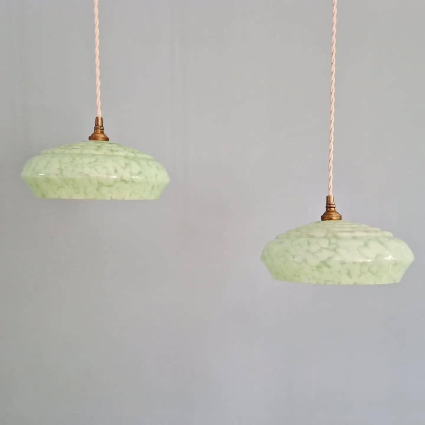 Pair of Art Deco light fixtures in light green speckled glass, 1930s.