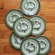 7 earthenware dessert plates with apple decoration and slip-brushed rim, KG Lunéville