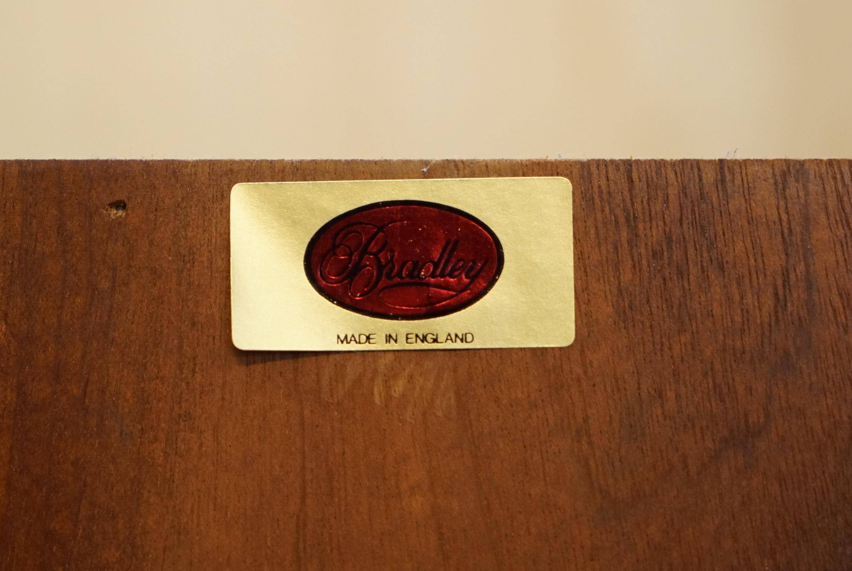 Open library Bradley Furniture made of yew wood with a cupboard base.