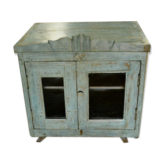 Showcase on grey blue glass 2 feet wearing old teak wood