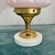 Art Deco lamp with pastel pink opaline globe.