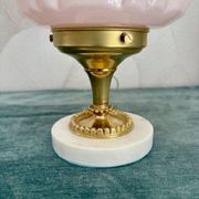 Art Deco lamp with pastel pink opaline globe.