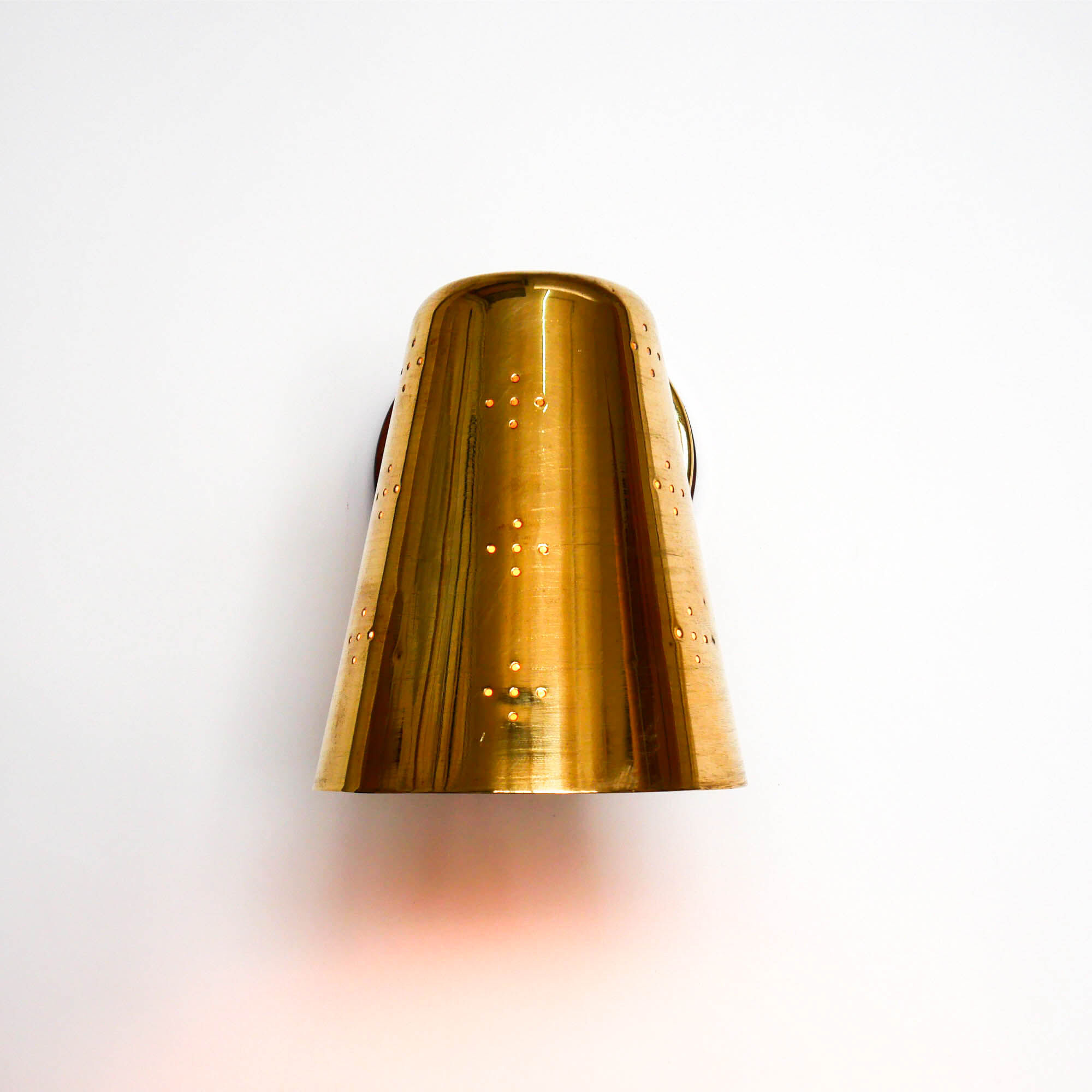 Old conical brass wall lamp, perforated lampshade