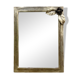 Vintage wall mirror in varnished steel decorated with a rose in relief