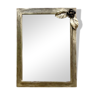 Vintage wall mirror in varnished steel decorated with a rose in relief