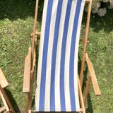 Pair of wooden deck chairs with armrests in blue bayadere fabric