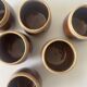 Service of 6 coffee cups in handcrafted glazed ceramic, amber brown, 1970.
