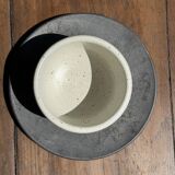 White Indonesian ceramic cup and gray saucer