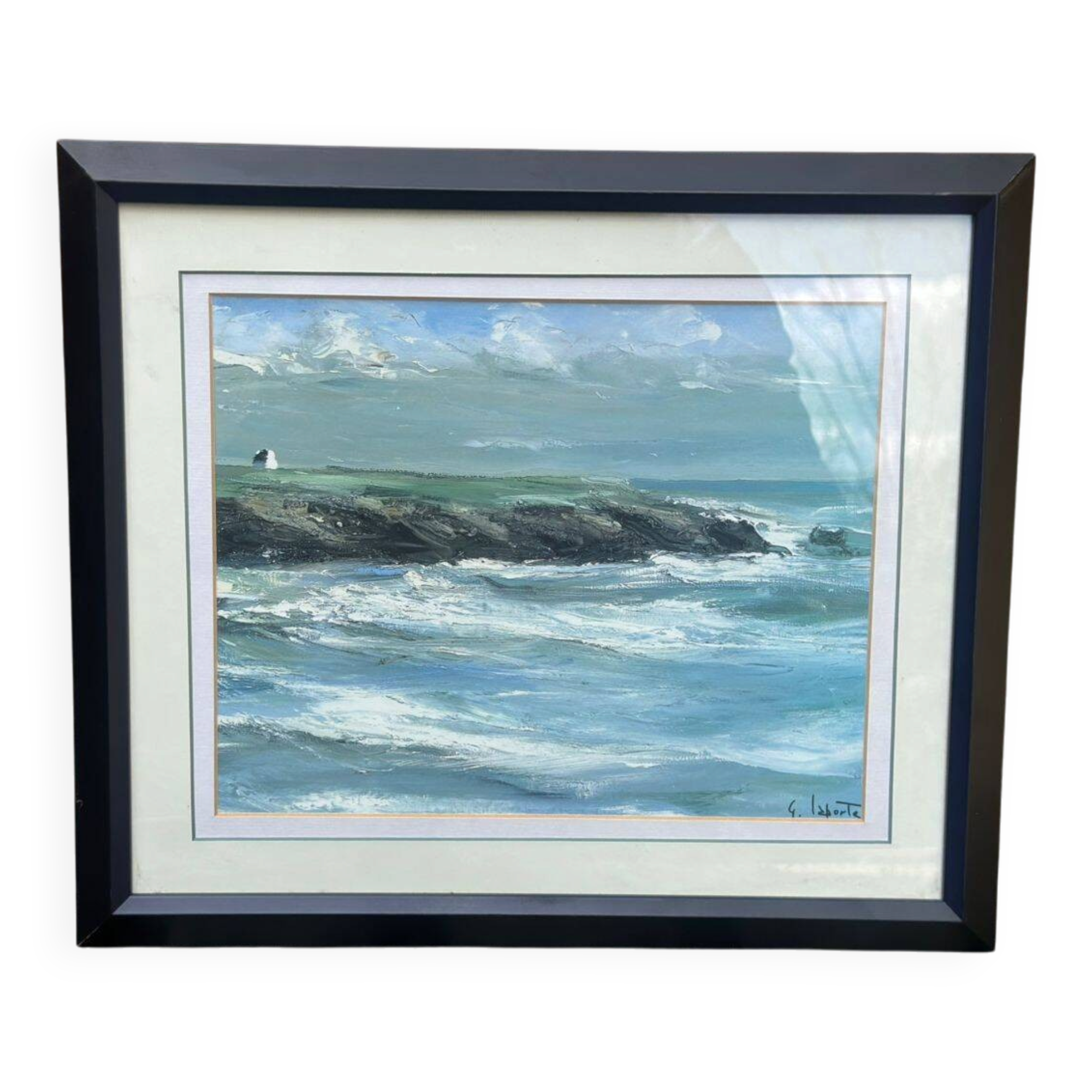 Framed oil painting on canvas of a seascape signed by Georges Laporte.