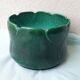 Green ceramic cache-pot