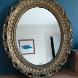 Mirror oval frame carved gilded patinated