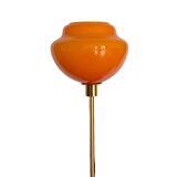 Table lamp with an old globe in vintage orange opaline