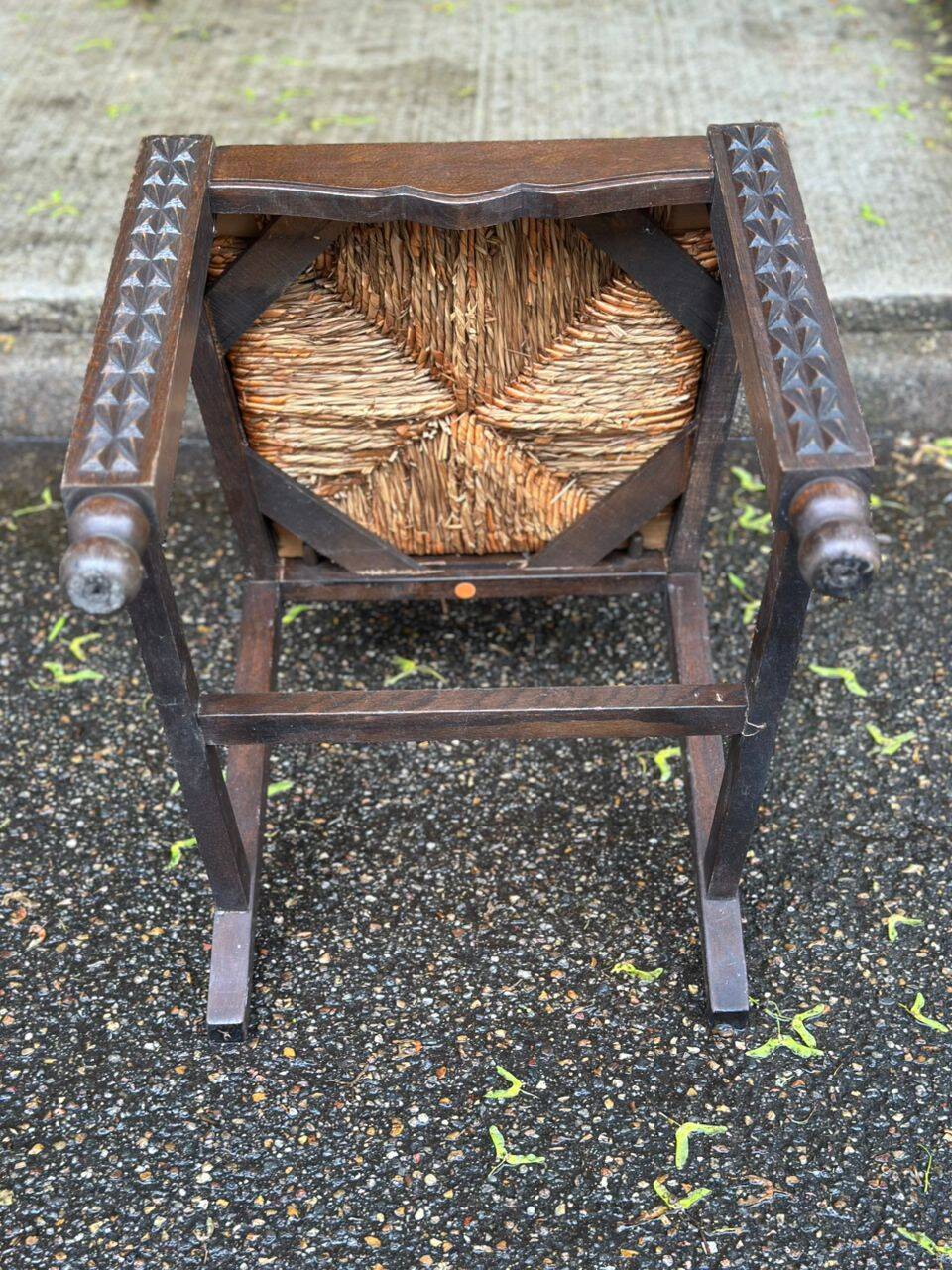 4 Basque solid wood dining chairs with carved straw seats.