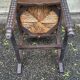 4 Basque solid wood dining chairs with carved straw seats.