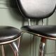 Suite de 4 chaises cuir synthétique noir & galon nacré