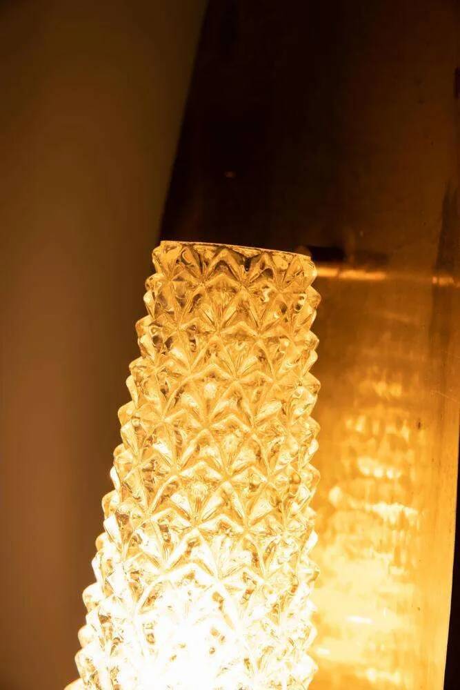 Vintage glass wall sconce from the 1960s in brass, mid-century light.