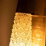 Vintage glass wall sconce from the 1960s in brass, mid-century light.