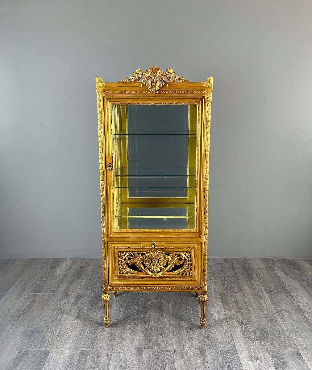 Carved and gilded wooden display cabinet, Louis XVI style, 20th century.