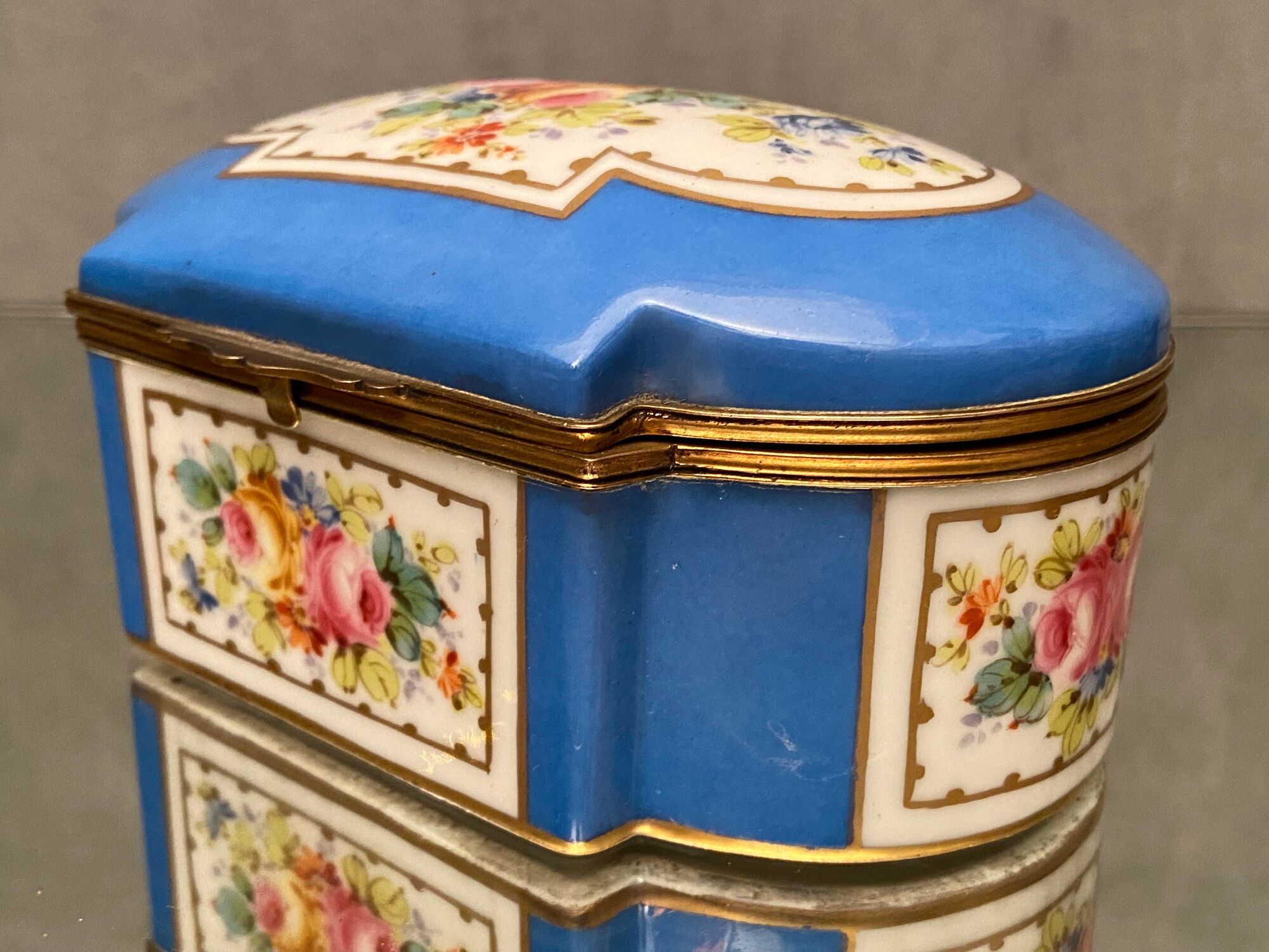 Domed porcelain box polychrome floral decoration on blue background brand Sèvres