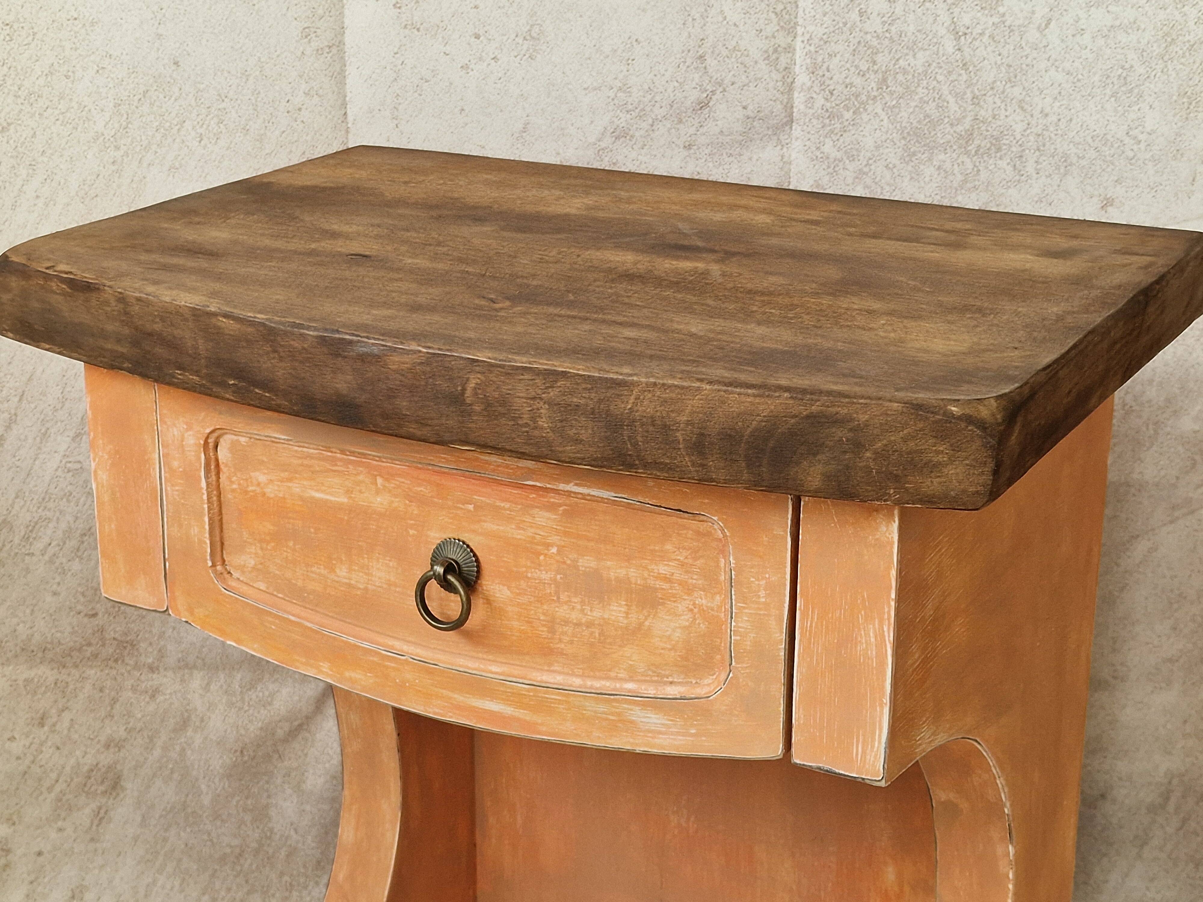 Pair of orange-pink patinated bedside tables