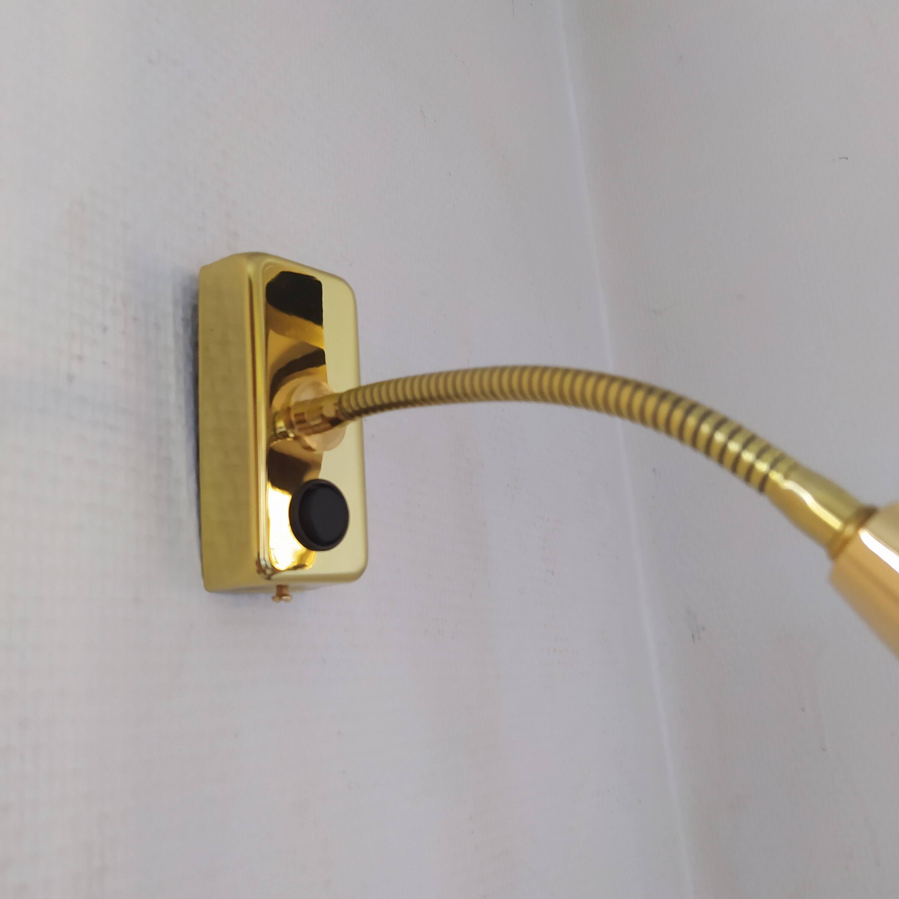 Pair of golden wall lights from the brossier saderne brand