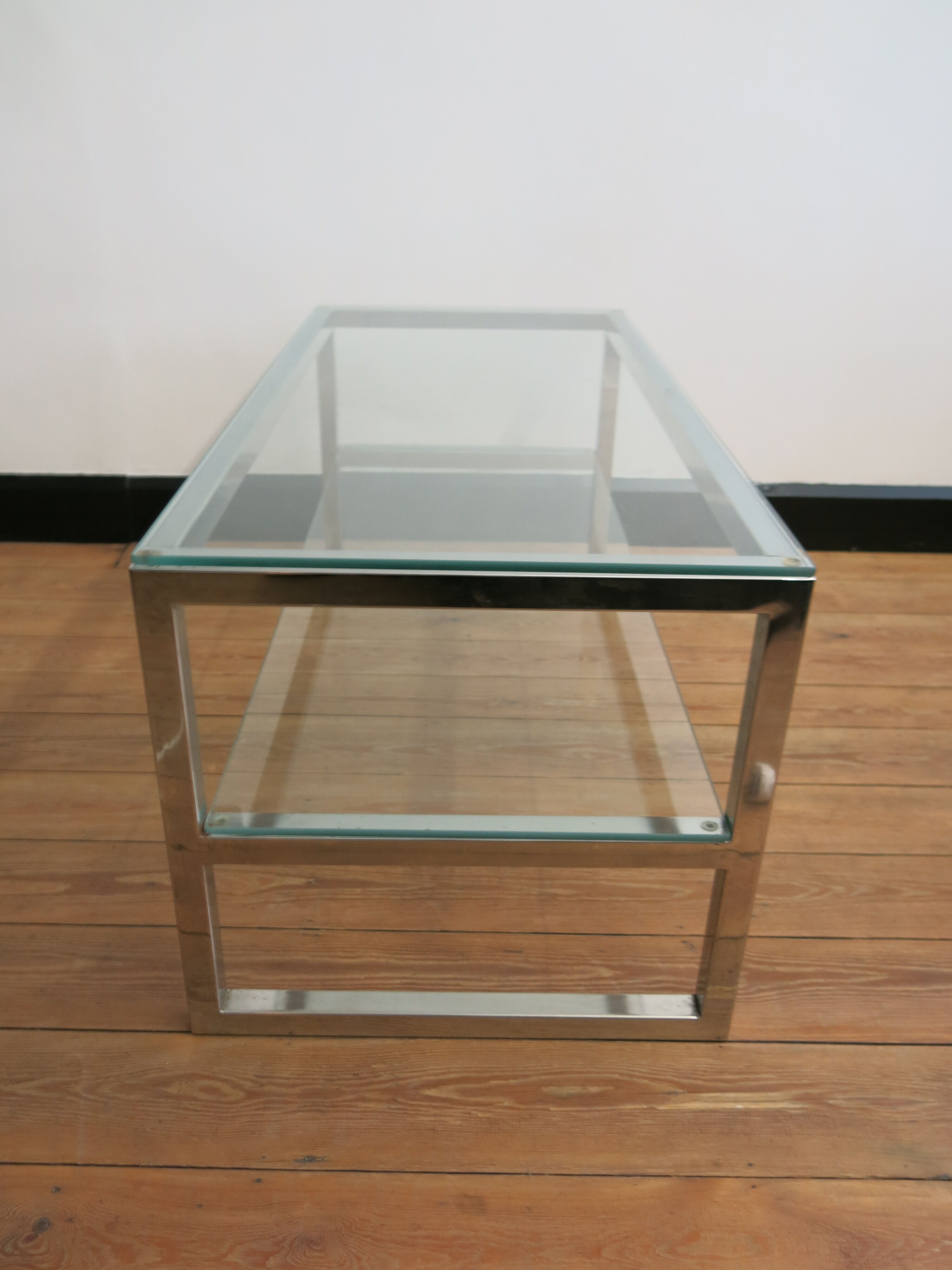 Coffee table in glass and chromed metal
