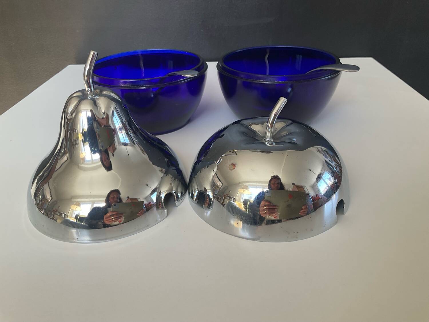 A pair of vintage cobalt glass and silver-plated sugar bowls.