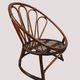 Fauteuil corbeille vintage en rotin à dossier soleil – Style Riviera, année