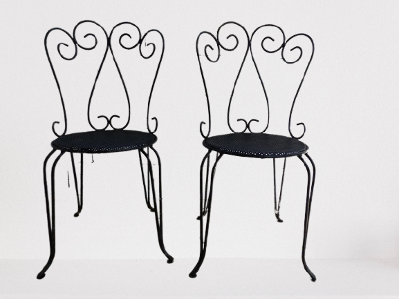 Pair of wrought iron garden chairs