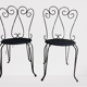 Pair of wrought iron garden chairs
