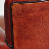 Armchair made of sheepskin leather in a red/brown color