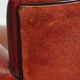 Armchair made of sheepskin leather in a red/brown color