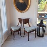 Pair of mahogany gondola chairs – Empire style – 20th century, restored