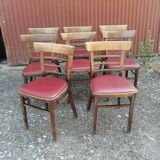 Set of 8 bistro chairs in vintage red wood and leatherette.
