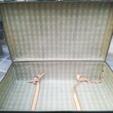 Old green cardboard suitcase