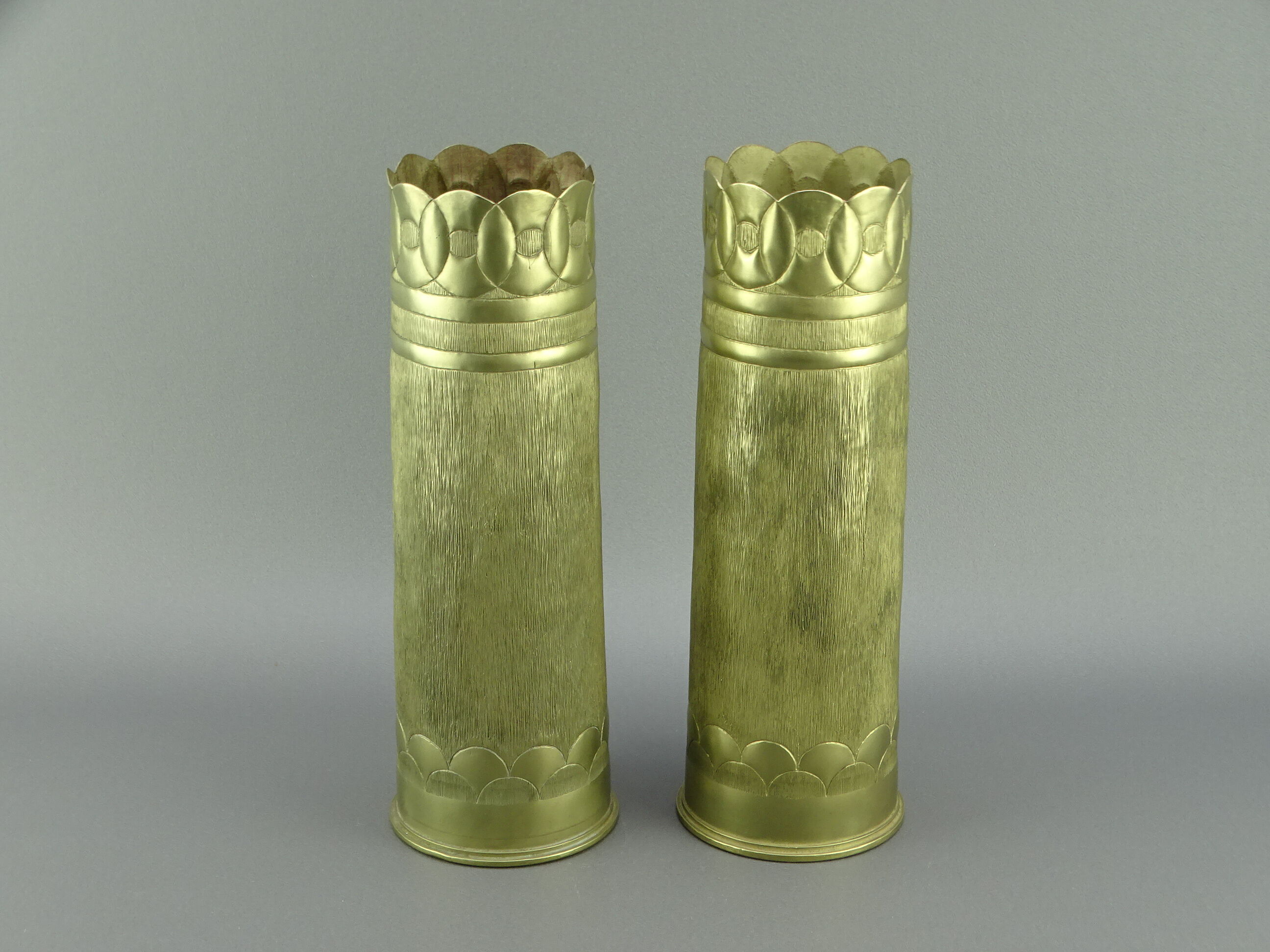 Pair of shell casings forming repulsed copper vases