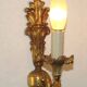 Pair of simple vintage French wall sconces in Art Nouveau bronze with leaf-shaped details.