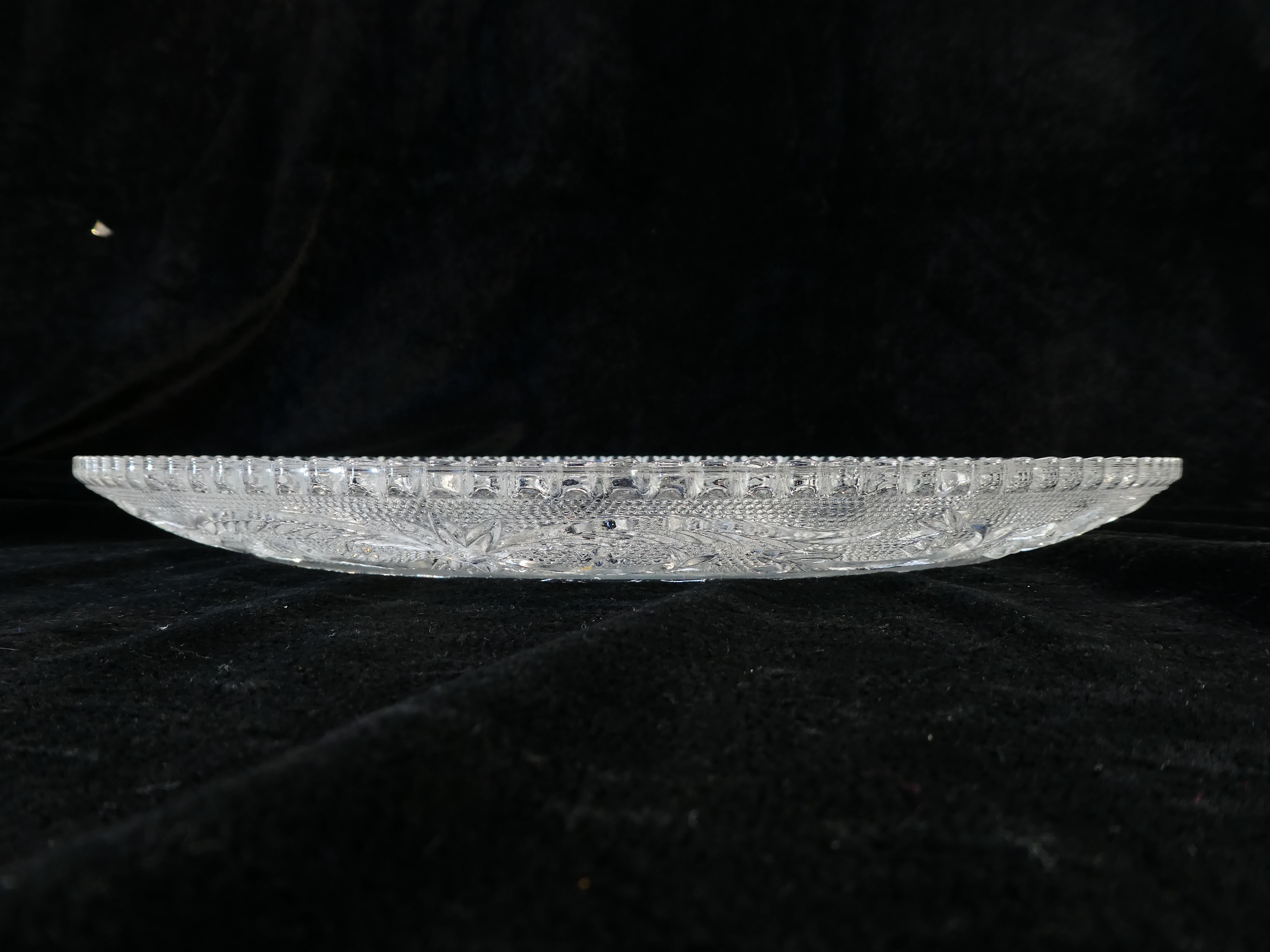 Old plate with pressed glass arabesque pie